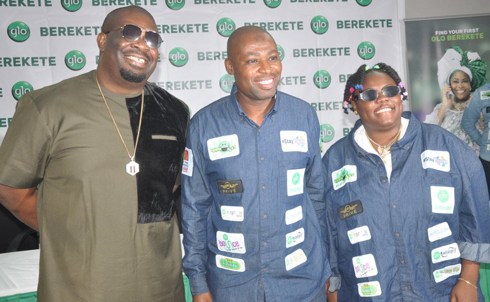 Globacom’s Regional Manager, Primary, Lagos 2, Abdulrazaq Ande, flanked by the company’s new brand ambassadors, Michael Collins Ajereh, also known as “Don Jazzy” (left)  and Teniola  Apata (Teni The Entertainer), at the launch of a new tariff plan called Glo Berekete, in Lagos on Tuesday.