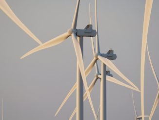 Apple cuts greenhouse gas emissions in half