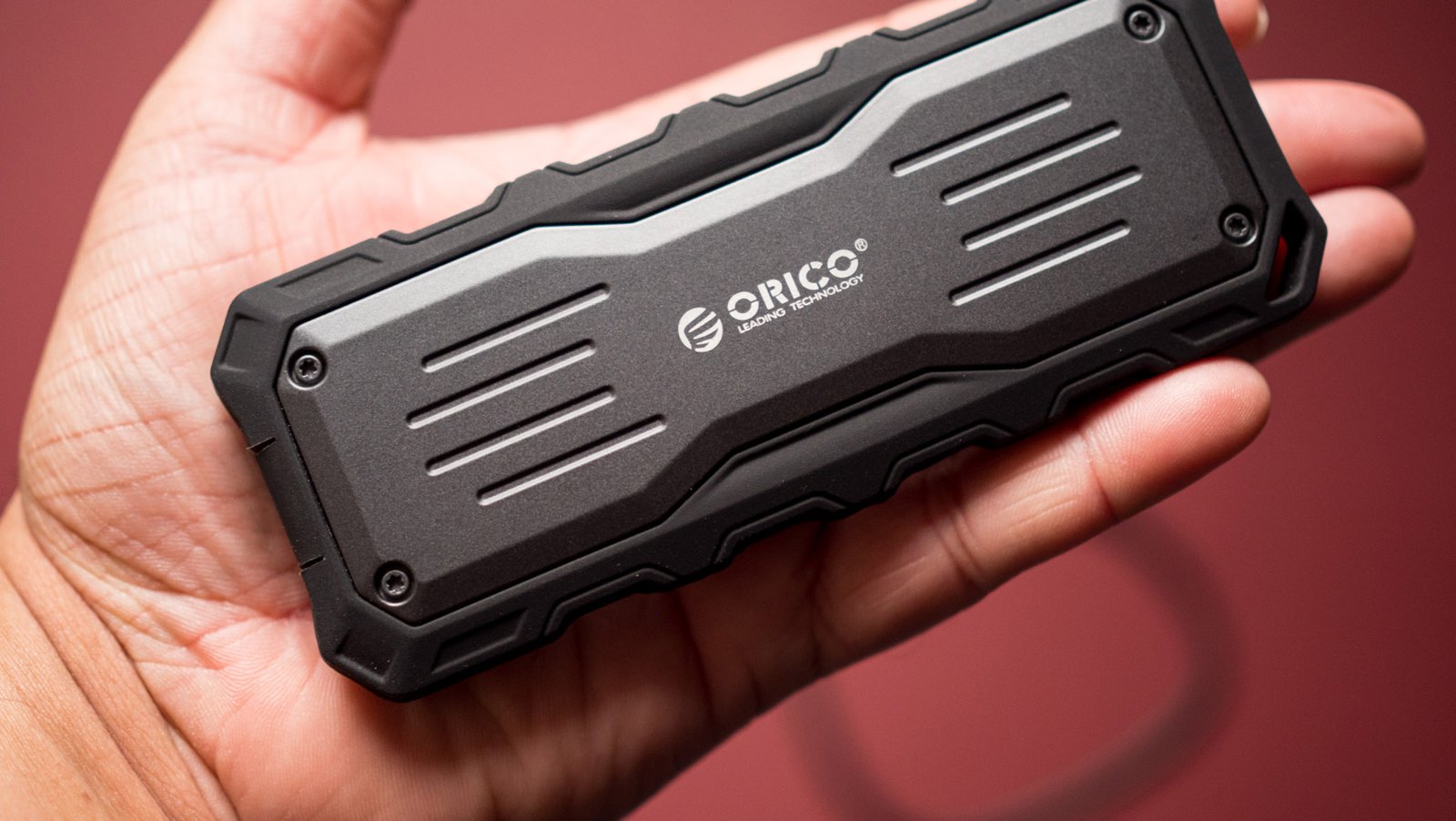 Orico Mecha O20 2TB SSD in hand, showing size