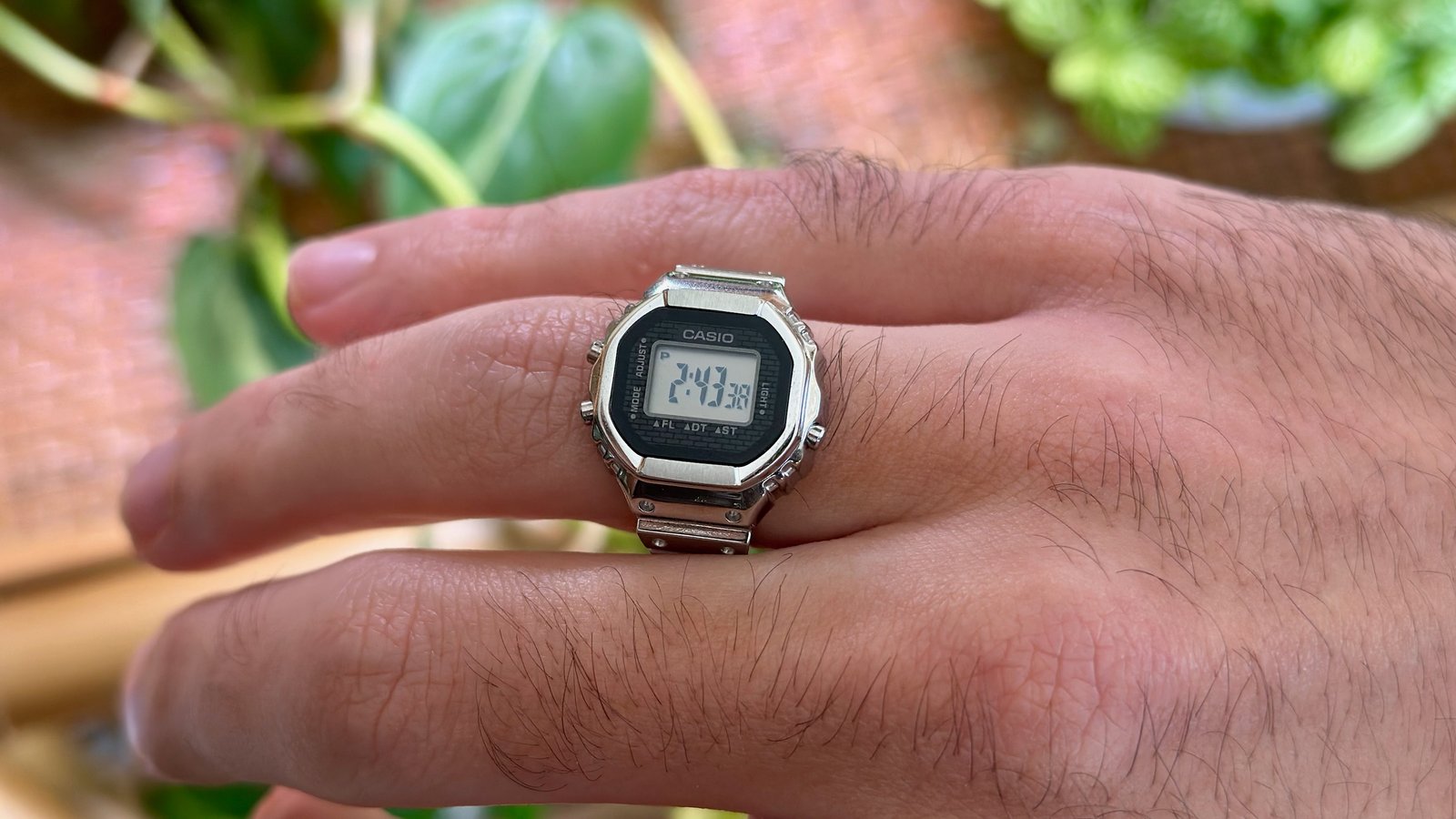 A close-up of the Casio CRW001-1 ring watch's default time display