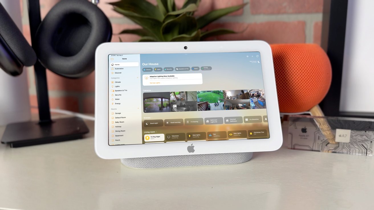 Tablet displaying home automation dashboard with security camera feeds and control options.