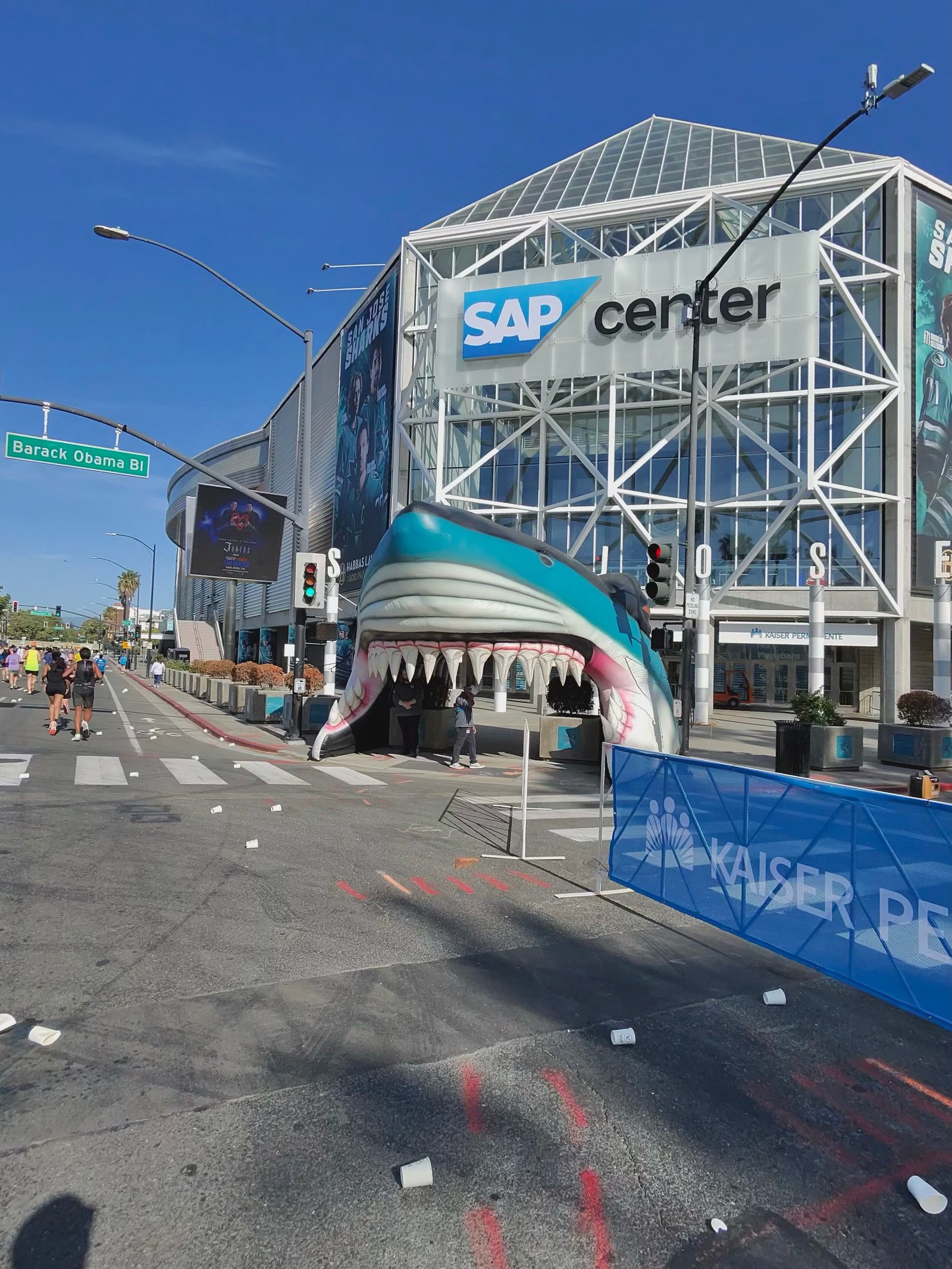 A Ray-Ban Meta smart glasses camera sample at the San Jose Half Marathon showing a giant shark statue in front of the SAP center.