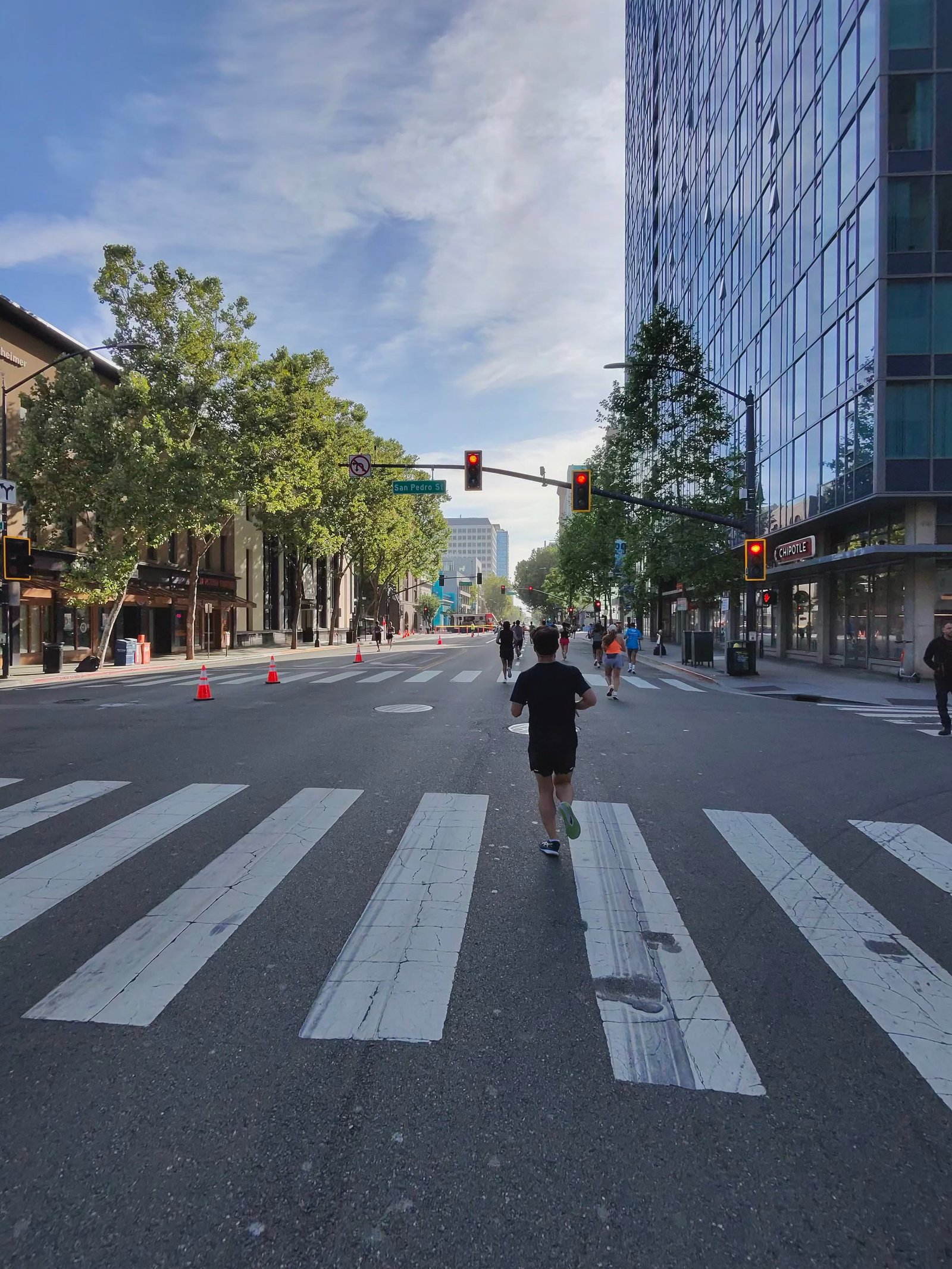 A Ray-Ban Meta smart glasses camera sample at the San Jose Half Marathon showing the lead runners of the race in the far distance.