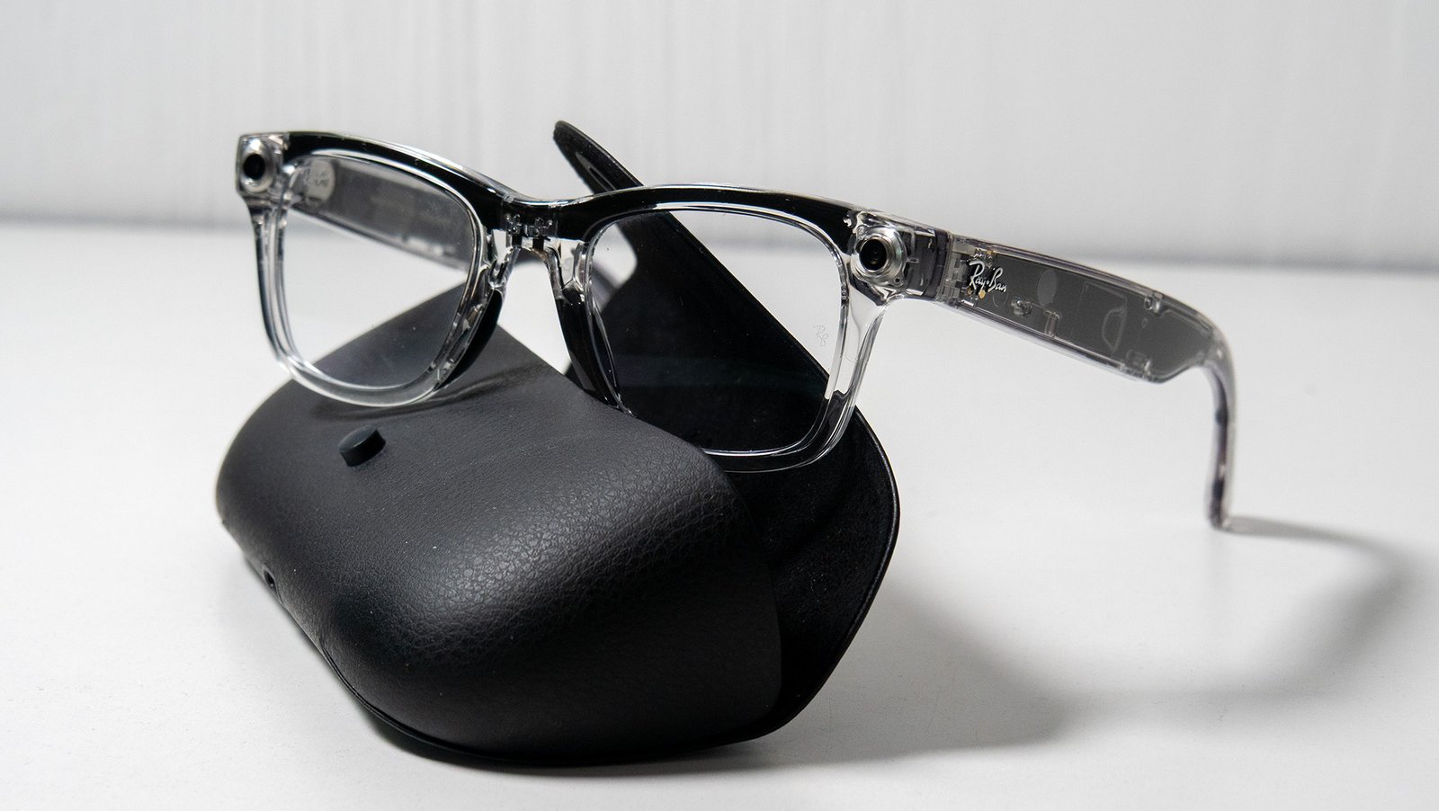 Special edition transparent Ray-Ban Meta Smart Glasses alongside their black leather charging case